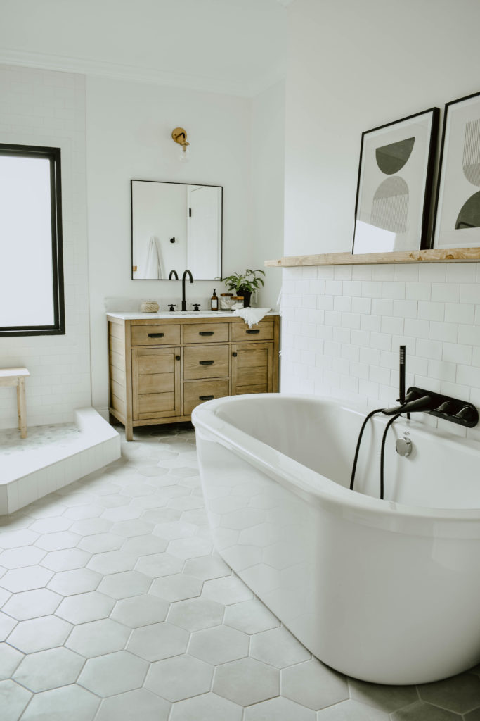 bathroom remodel, white bathroom, white subway tile wall, matte black tub filler, white free