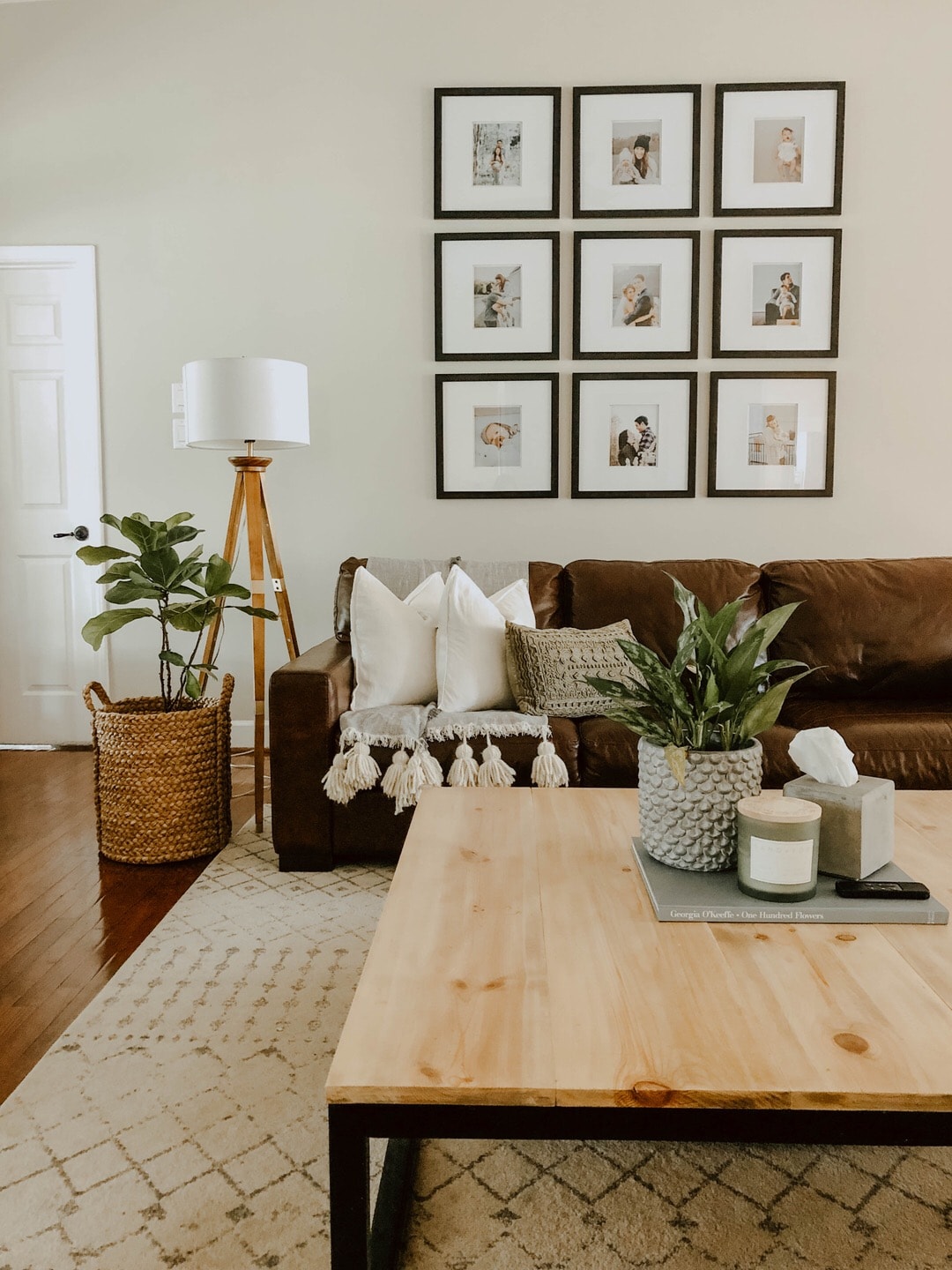 neutral living room with gallery wall and wooden coffee table